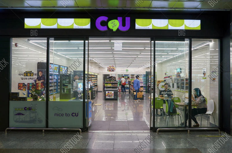 Tourists using Seoul Metro 2025 T-Money card at a station