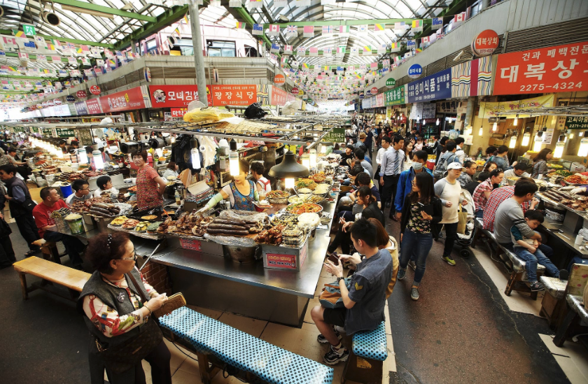 Traditional Seoul food market with sundae, pancakes, and local Korean street food