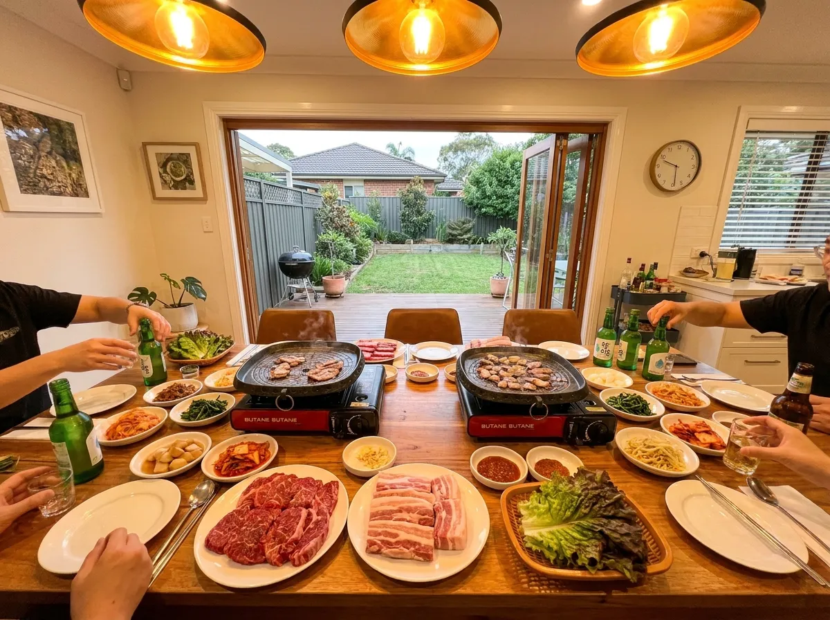 Korean BBQ party guide Australia setup: Multiple grill pans, banchan, and ssam ingredients on a large dining table in Sydney.