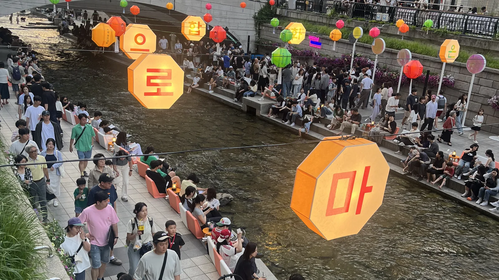 Cheonggyecheon lantern festival with colourful character lanterns over the stream
