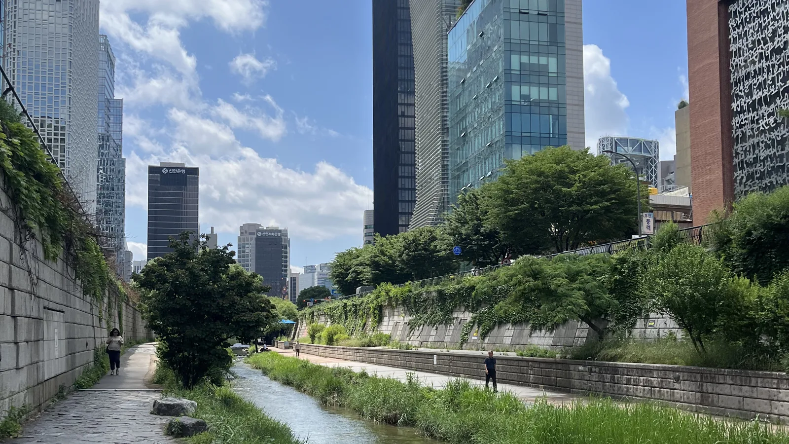 Cheonggyecheon stream walk in Seoul beside the restored stream and downtown towers