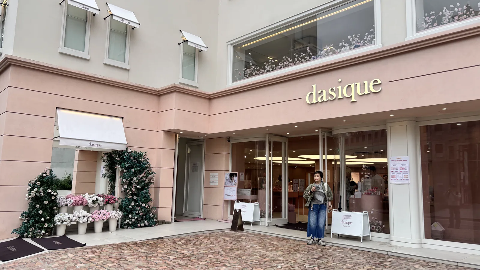 Korean makeup brand flagships in Seongsu, the pink dasique storefront with fresh flowers