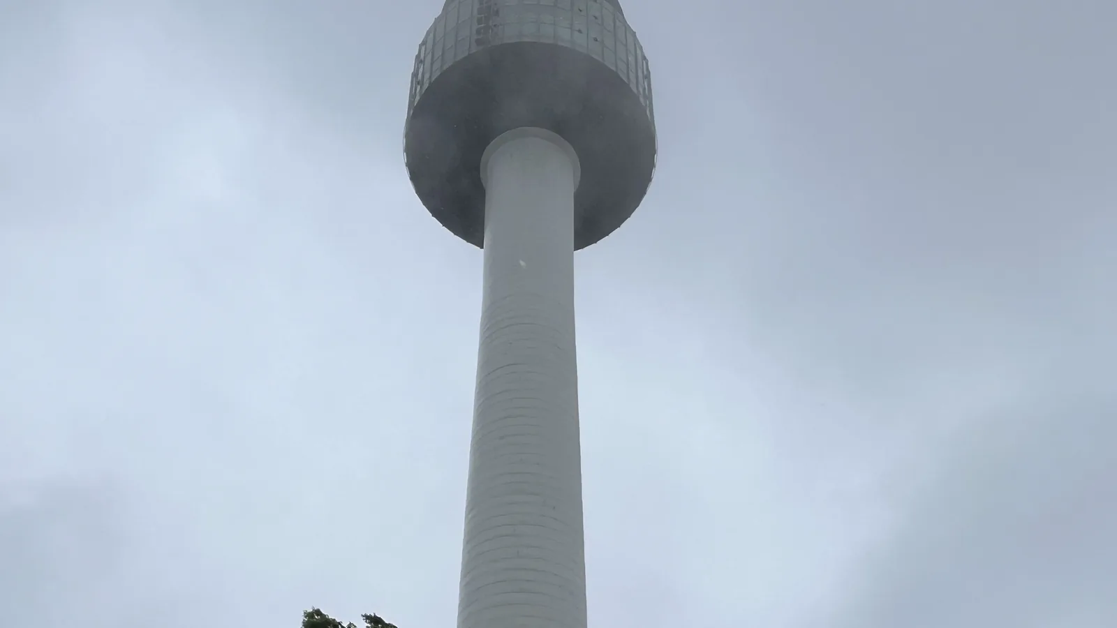 N Seoul Tower observatory deck seen from below on a foggy day