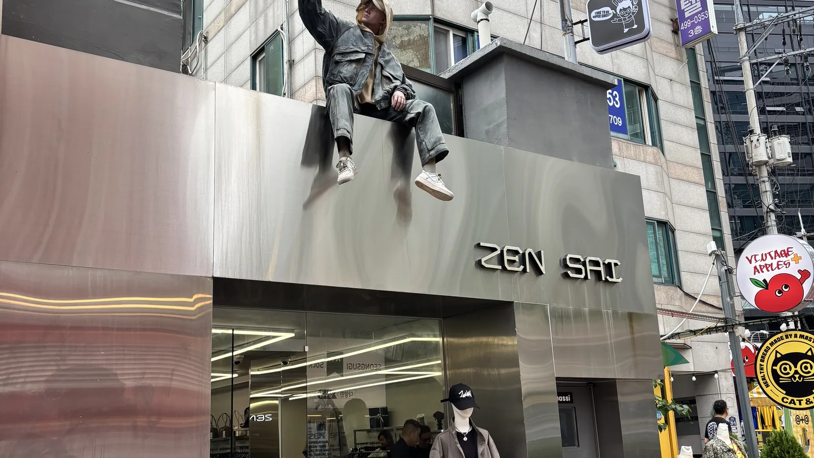 Korean fashion brands in Seongsu — the NBZ mirror facade with a seated figure out front