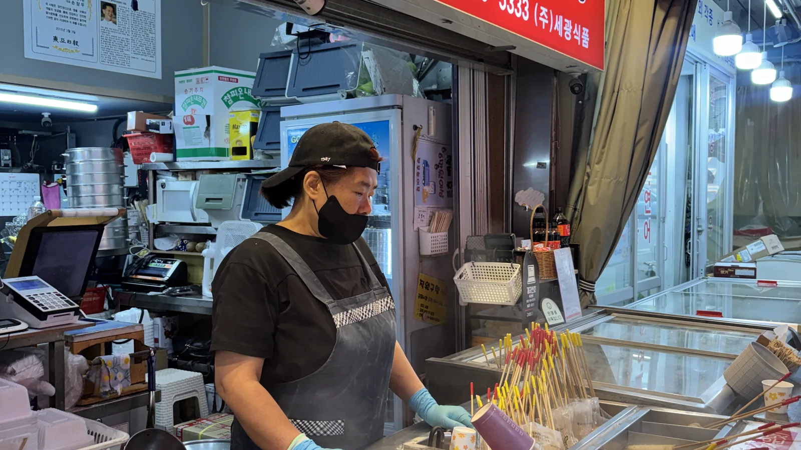 What to buy at Namdaemun Market shown by a stall of dried goods and snacks
