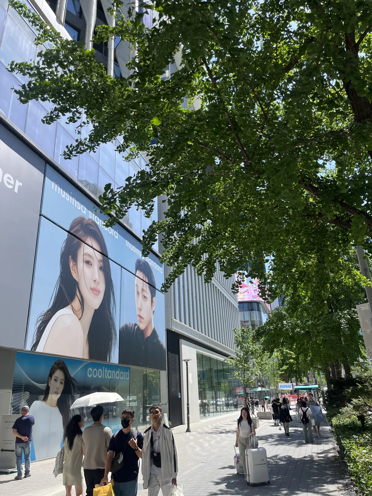 Musinsa flagship and billboards beside Hongik University Station Exit 9 in Hongdae