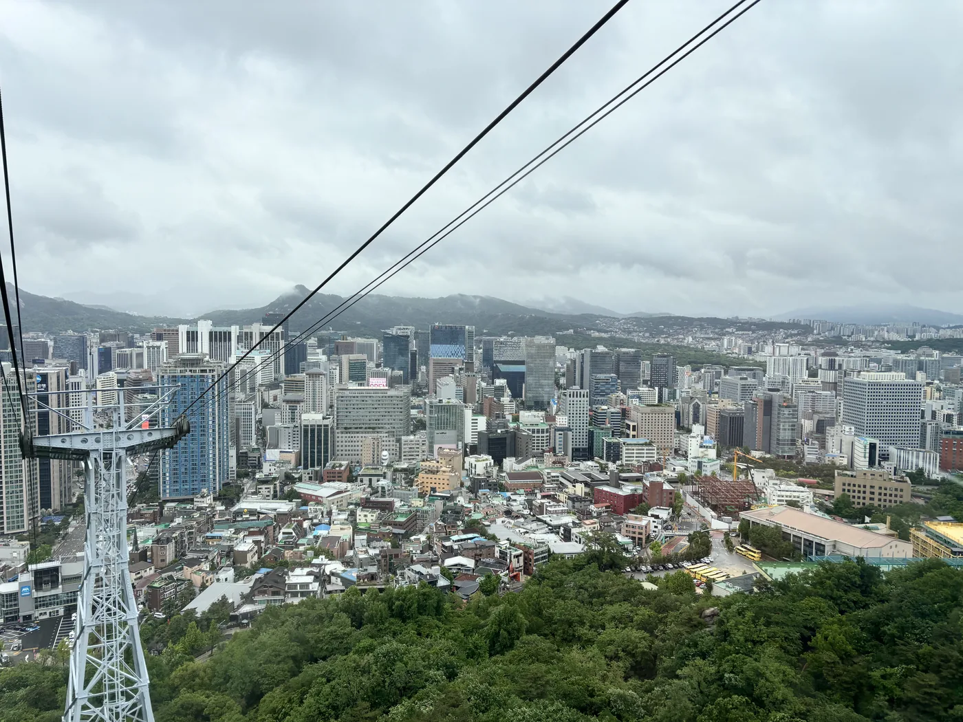 Namsan Seoul Tower guide view of Seoul city from the cable car on a foggy day
