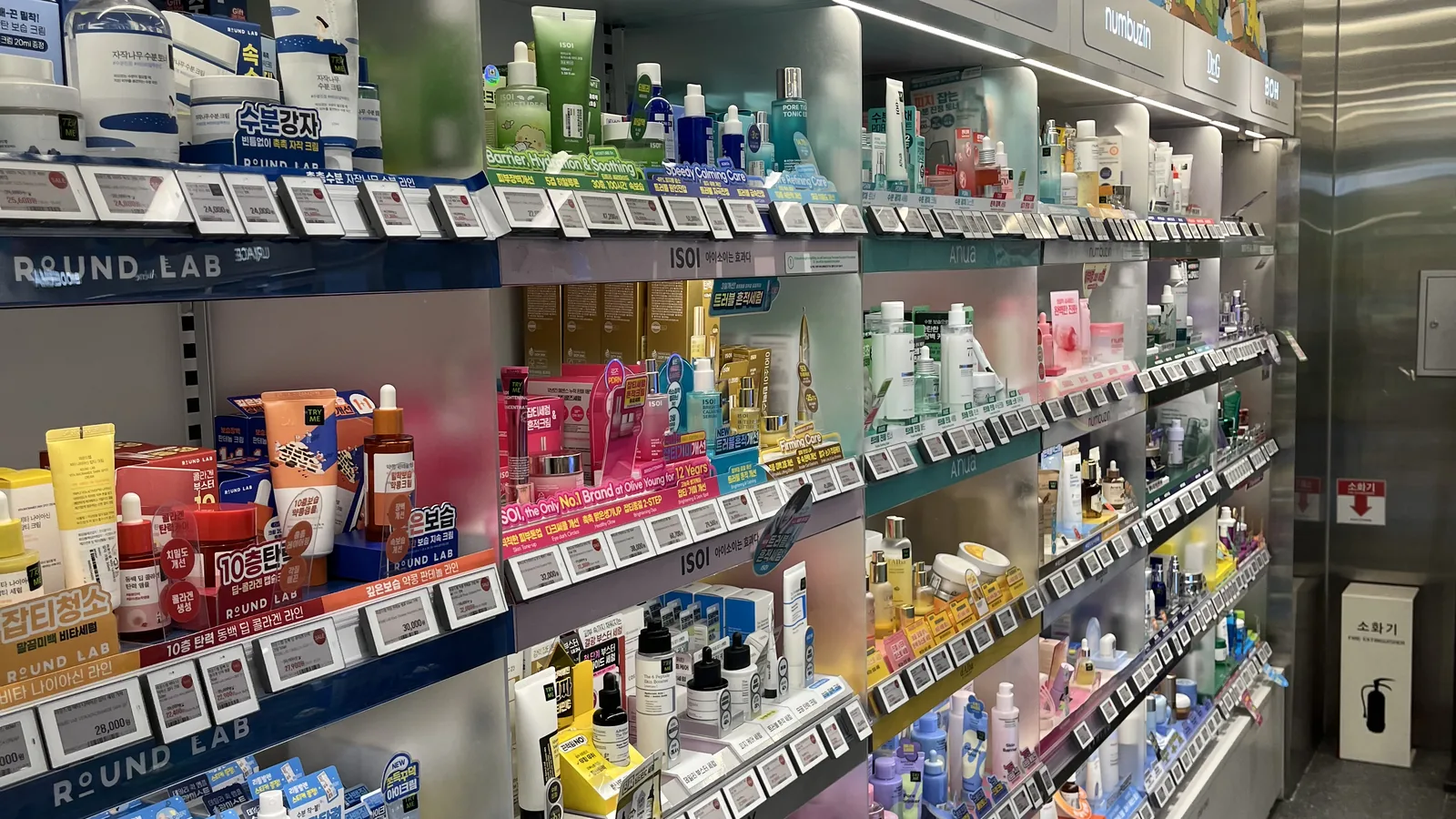 Olive Young for sensitive skin options on a Round Lab and isoi skincare shelf wall in Seoul