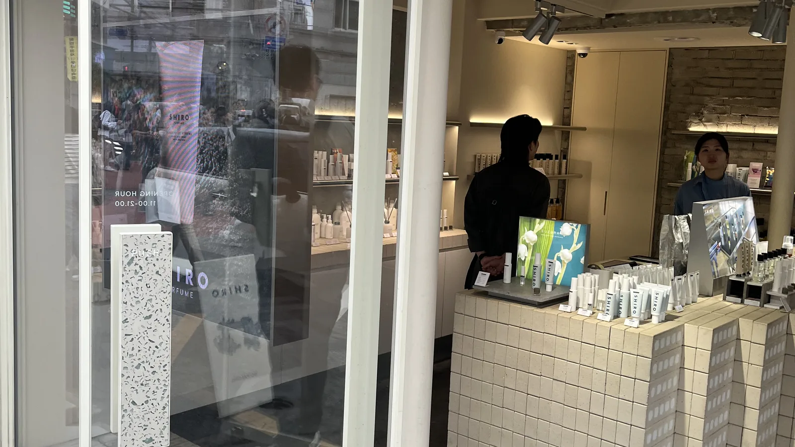 Korean skincare shops in Seongsu storefront interior at SHIRO with pale wood shelves and fragrance displays