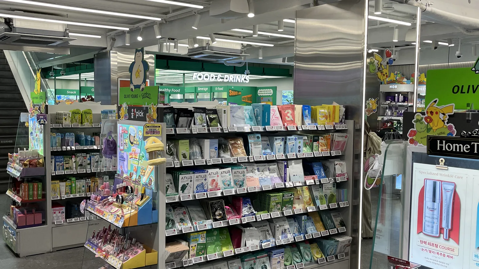 Best Korean sunscreens at Olive Young chosen from a skincare shelf in a Seoul store