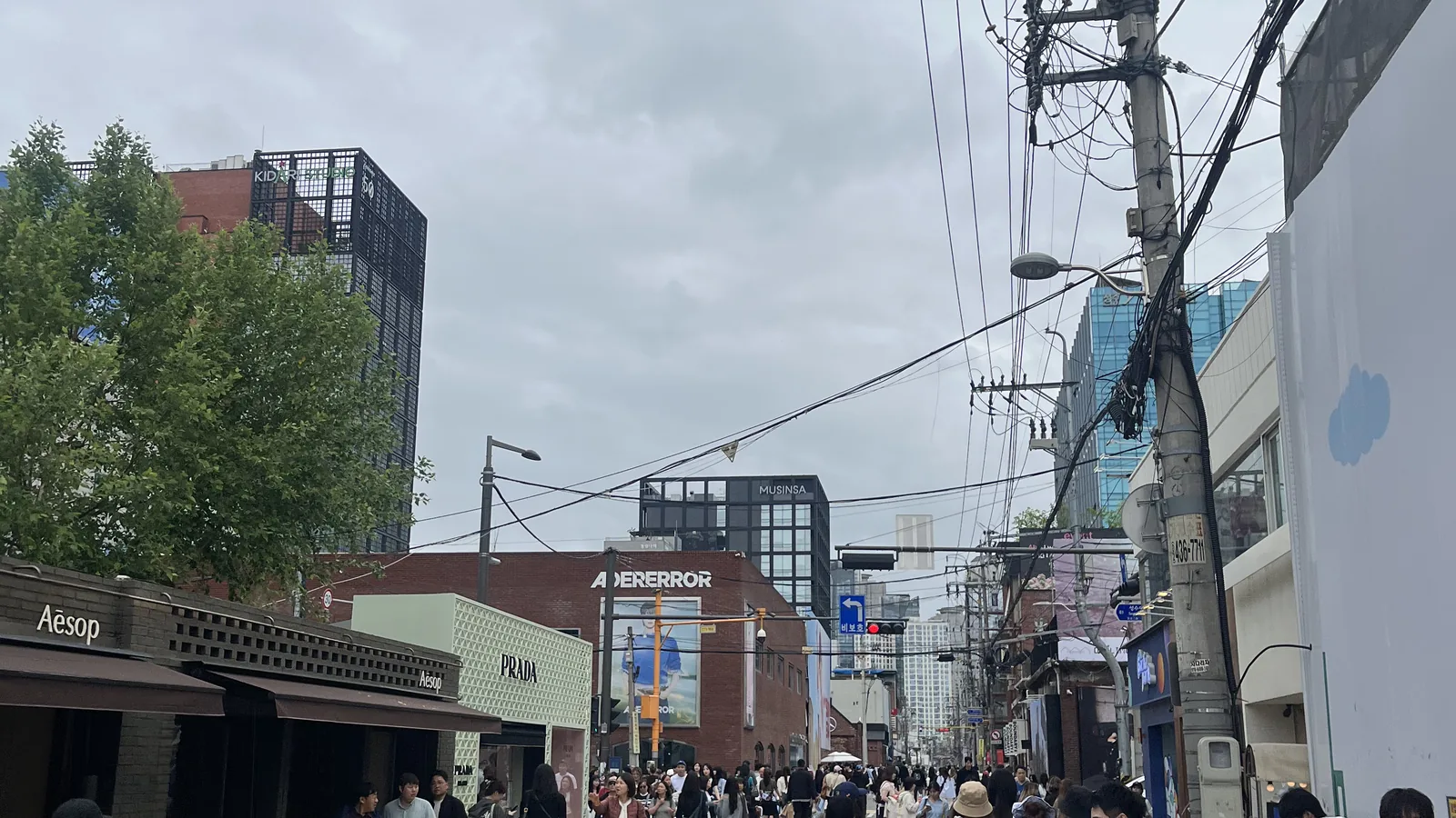 Seongsu fashion flagship stores main street crowd near the ADERERROR storefront in Seongsu-dong