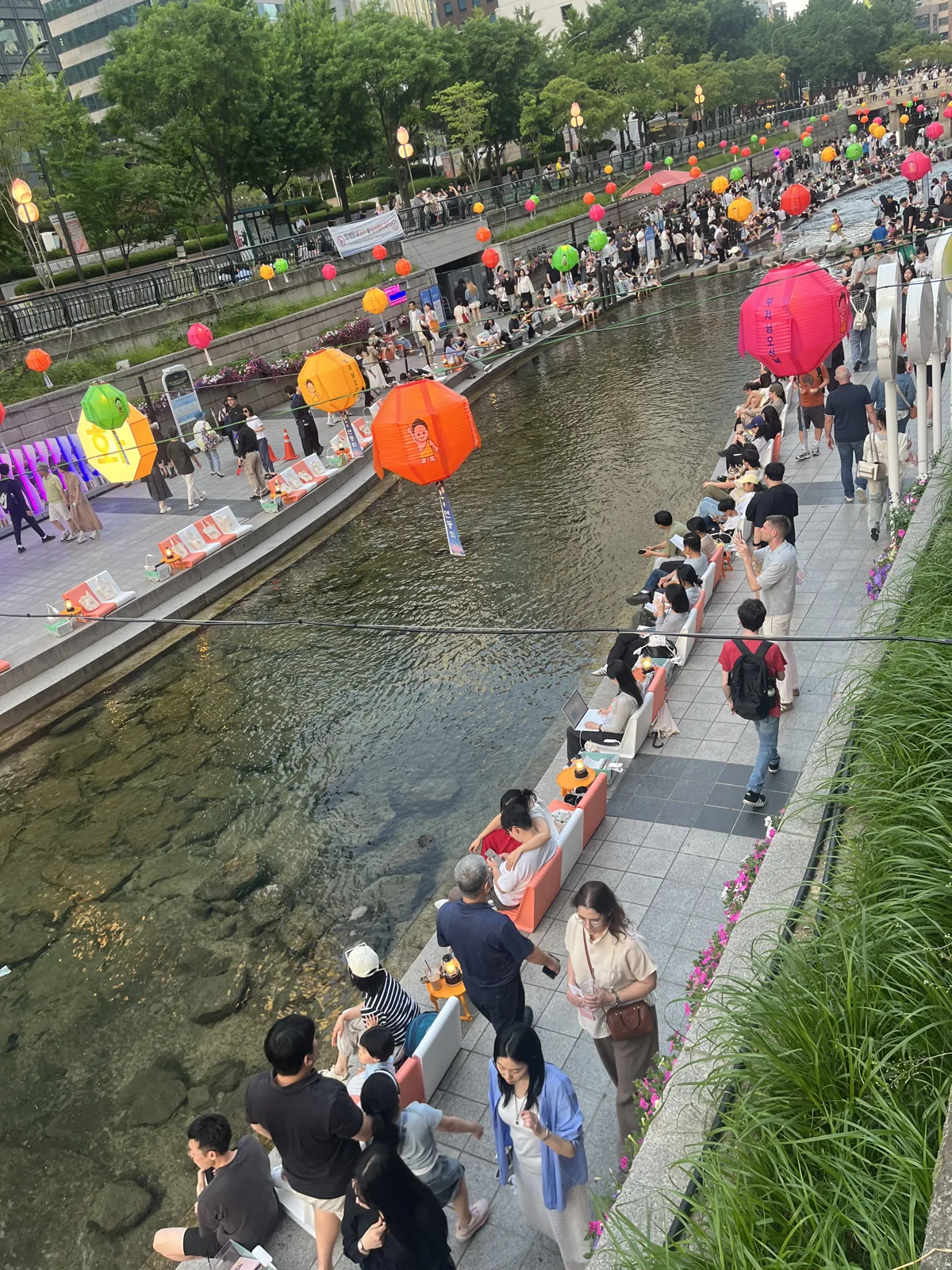 Cheonggyecheon stream walk in Seoul during lantern season with colourful lanterns above the water