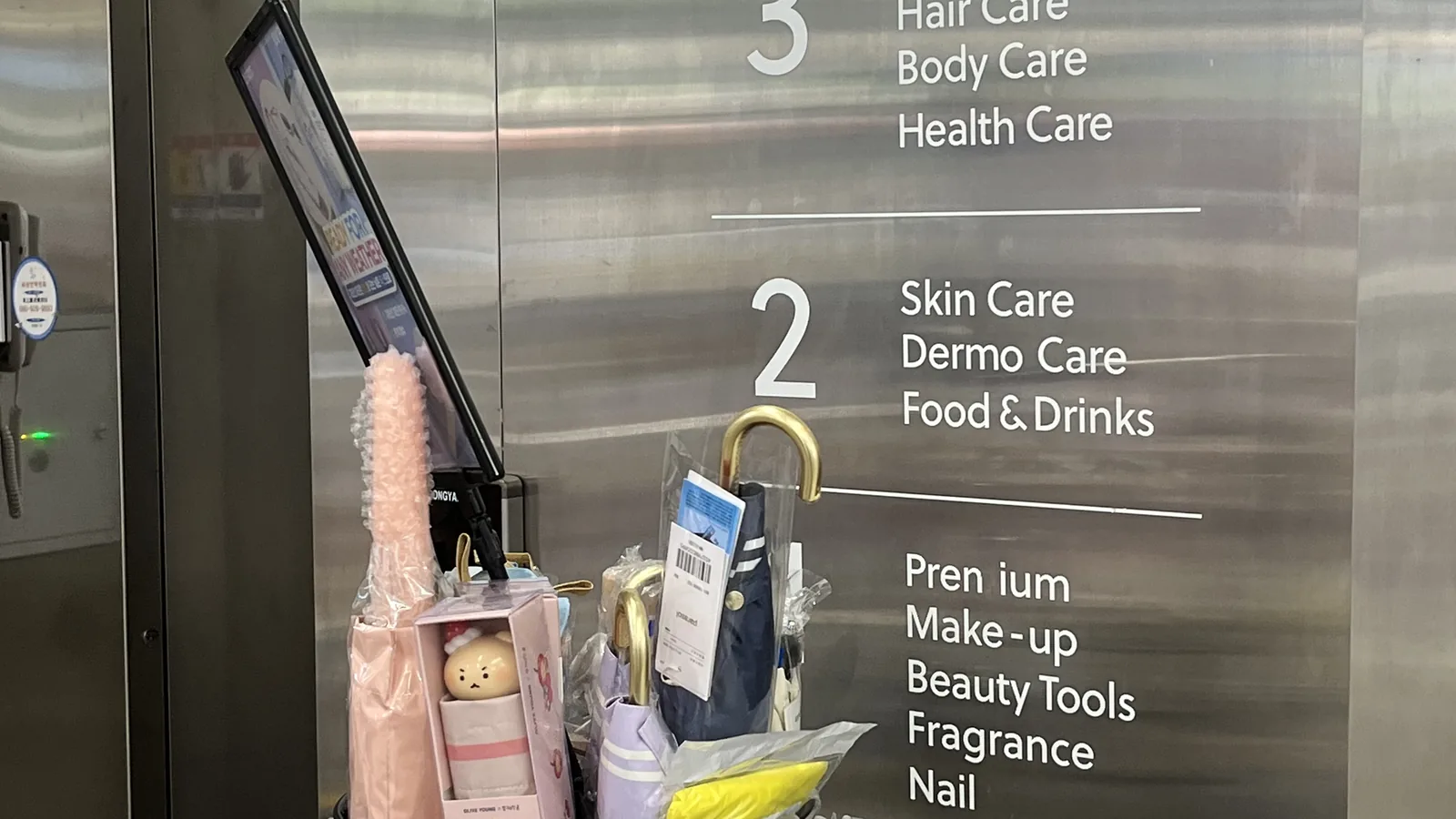 Olive Young Gangnam floor directory sign listing makeup skincare and grooming floors