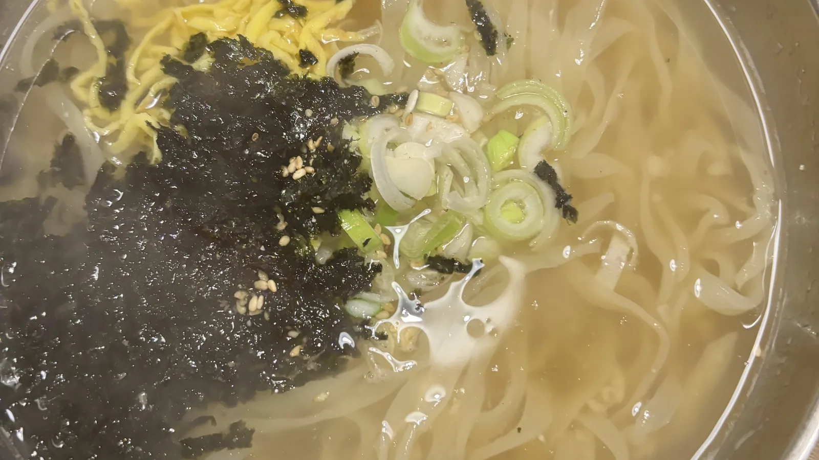 best restaurants in Myeongdong serving a steaming bowl of kalguksu knife-cut noodle soup
