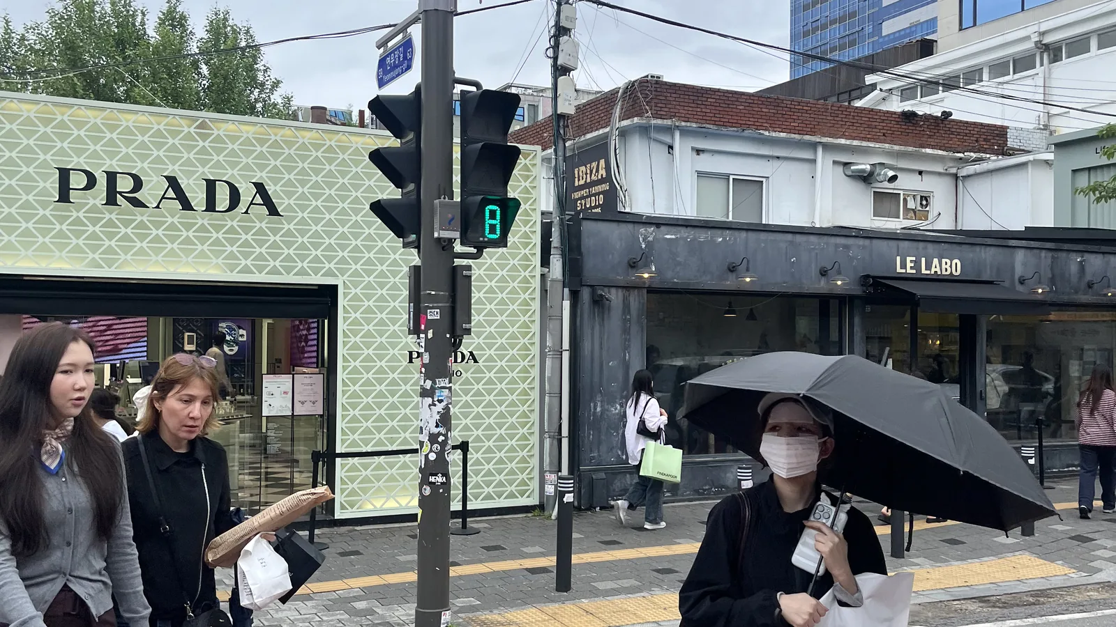luxury pop-ups in Seongsu with the Prada corner and Le Labo across the street crossing