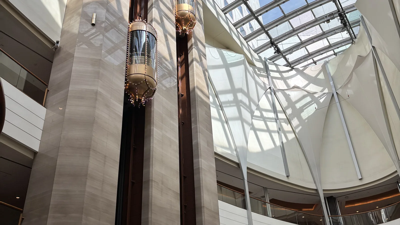 Lotte Hotel World review dramatic glass-roof atrium with geometric glass and steel structure