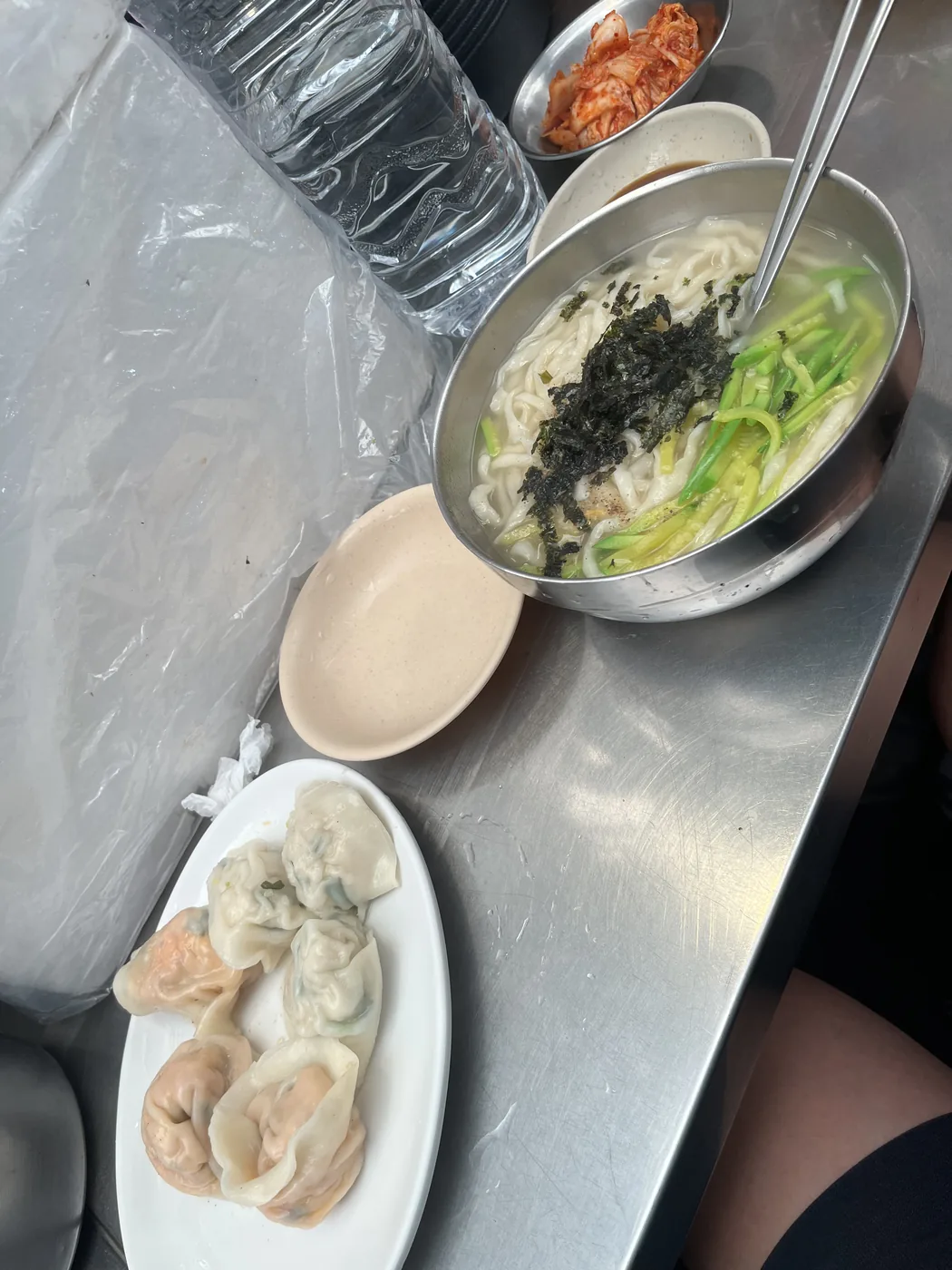 What to eat at Gwangjang Market shown by a bowl of hand-cut noodle soup