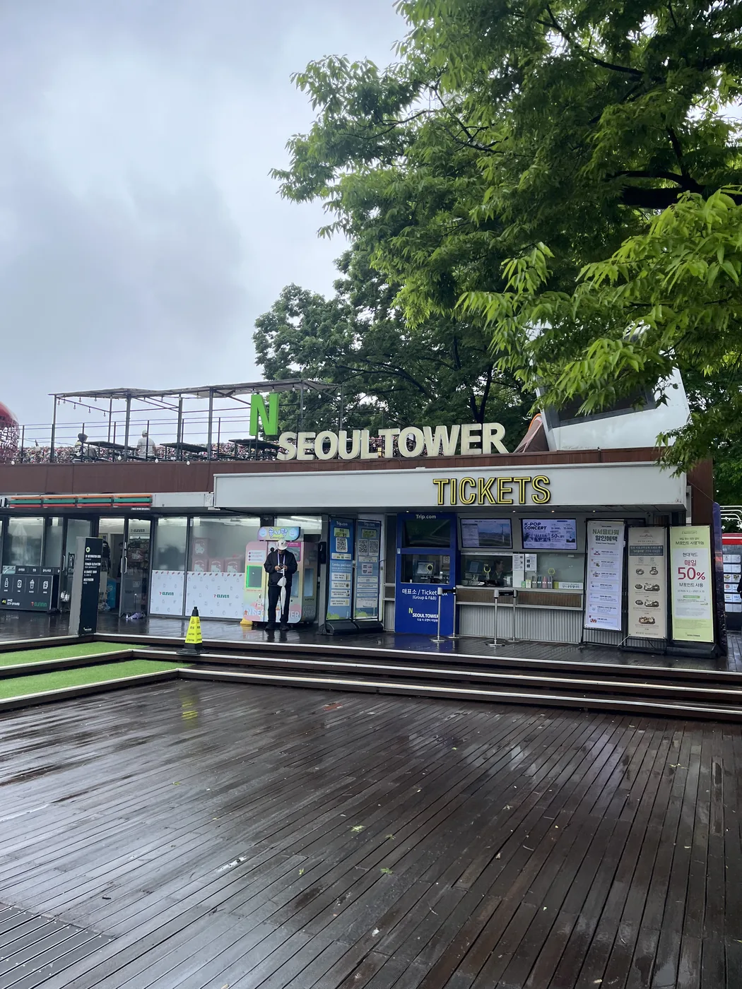 Namsan hiking trail arriving at the tower base deck by the Seoul Tower sign