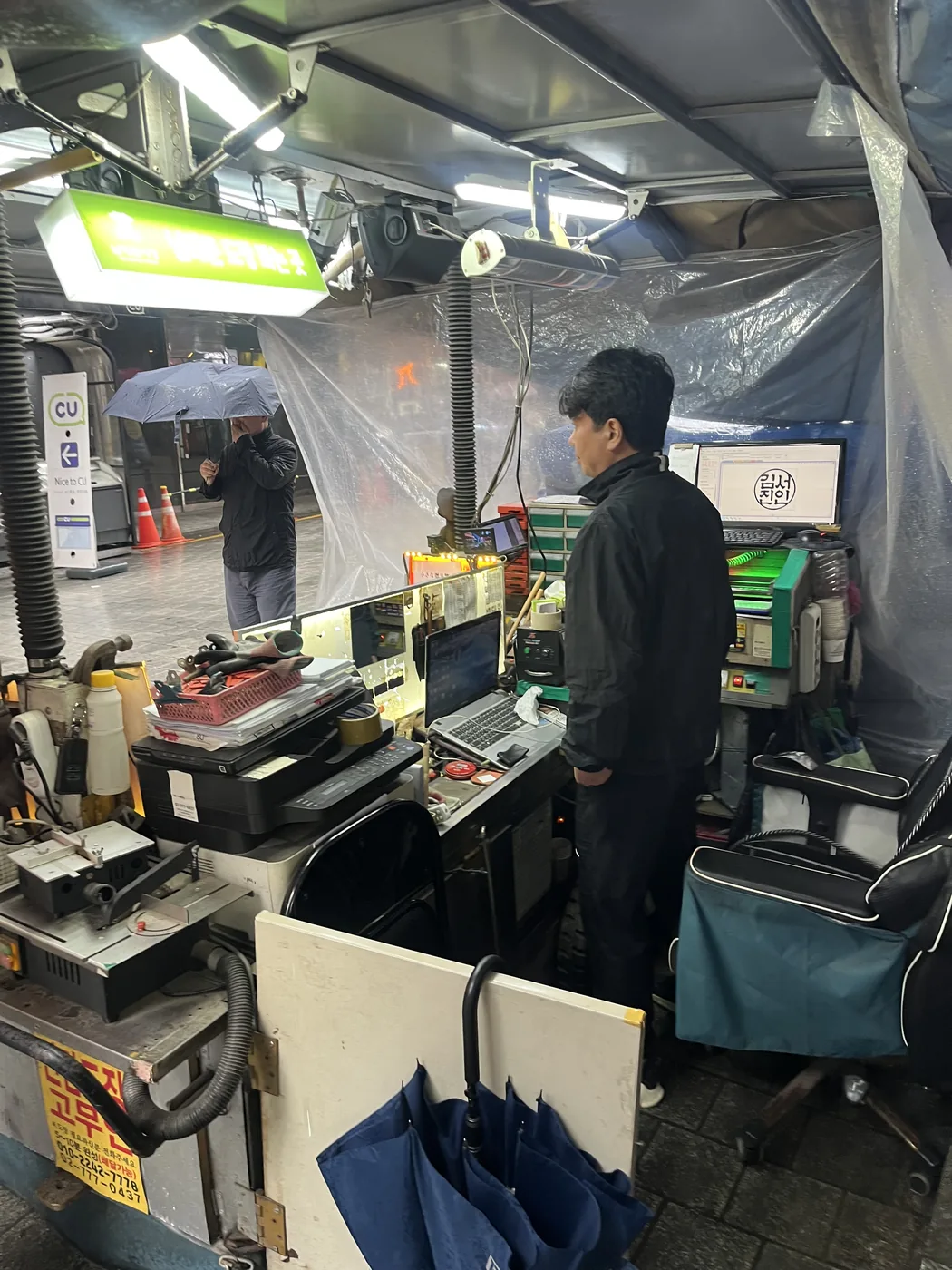 What to buy at Namdaemun Market shown by a craftsperson carving a custom name stamp