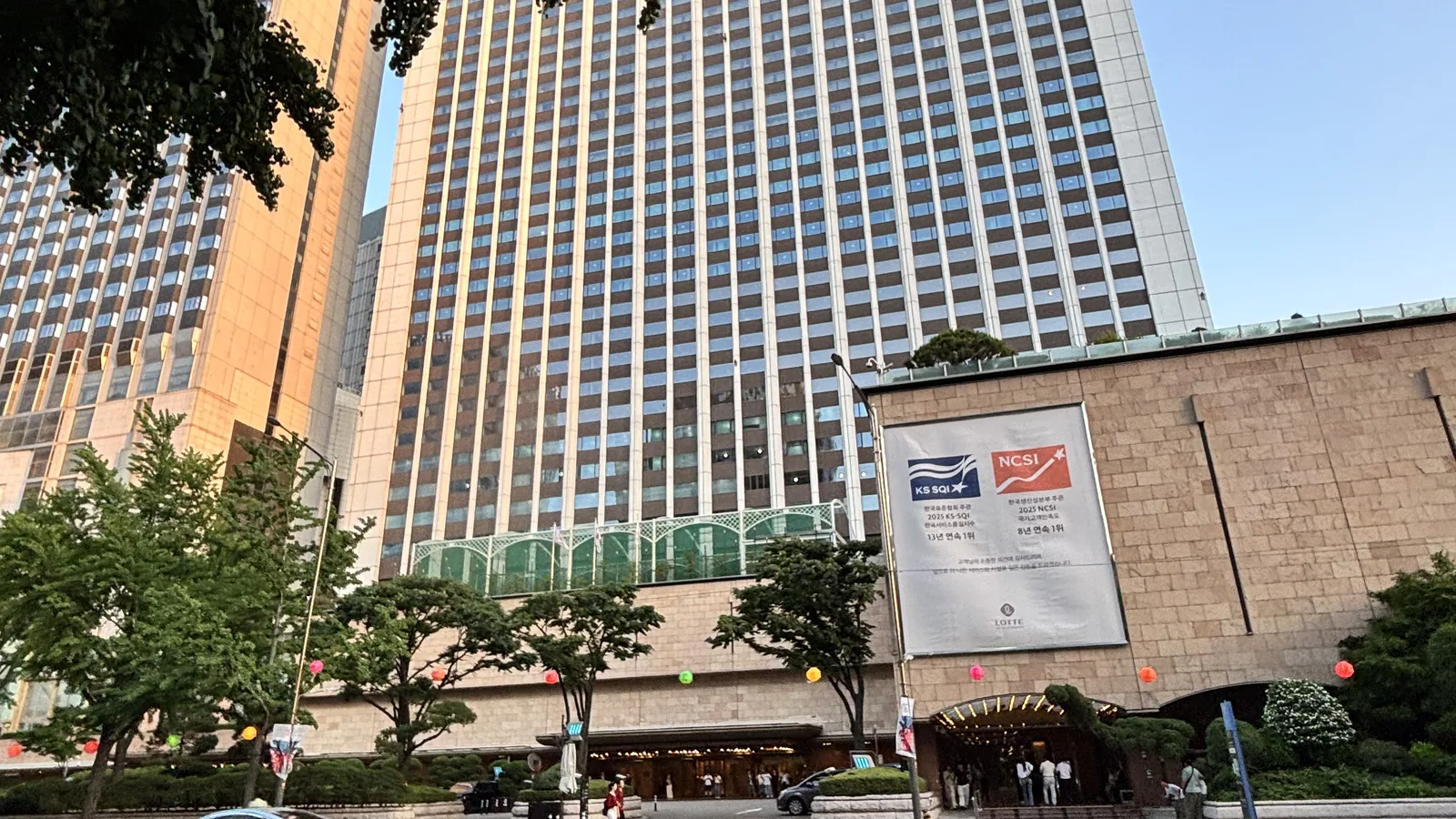 Large Lotte landmark hotel and department store towers showing where to stay in Myeongdong