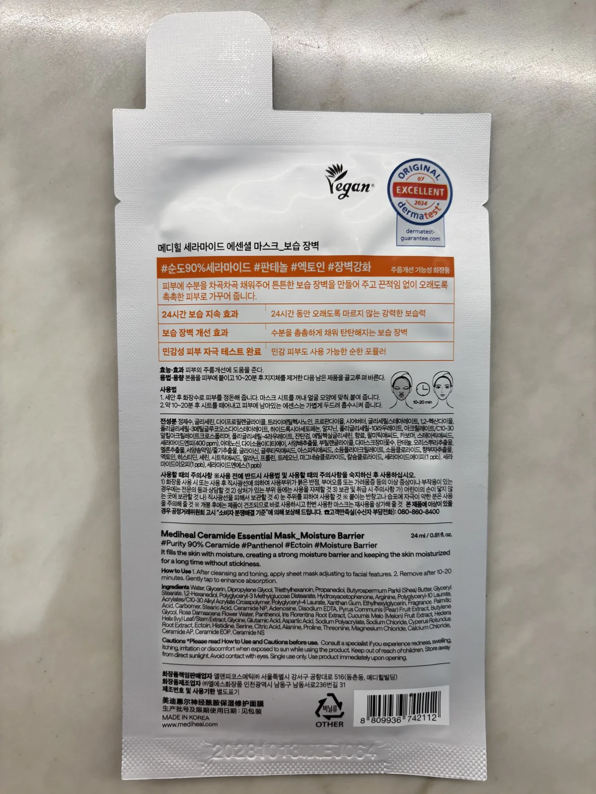 Mediheal Ceramide Mask yellow sheet mask pack showing the CERAMIDE 90% claim on marble