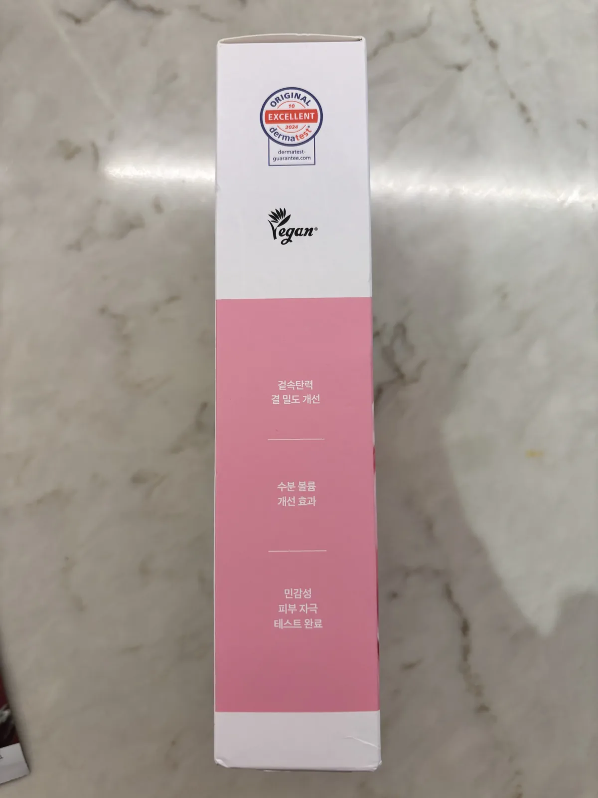 Mediheal Collagen Mask pink box beside the Rose PDRN mask sachet on a marble surface