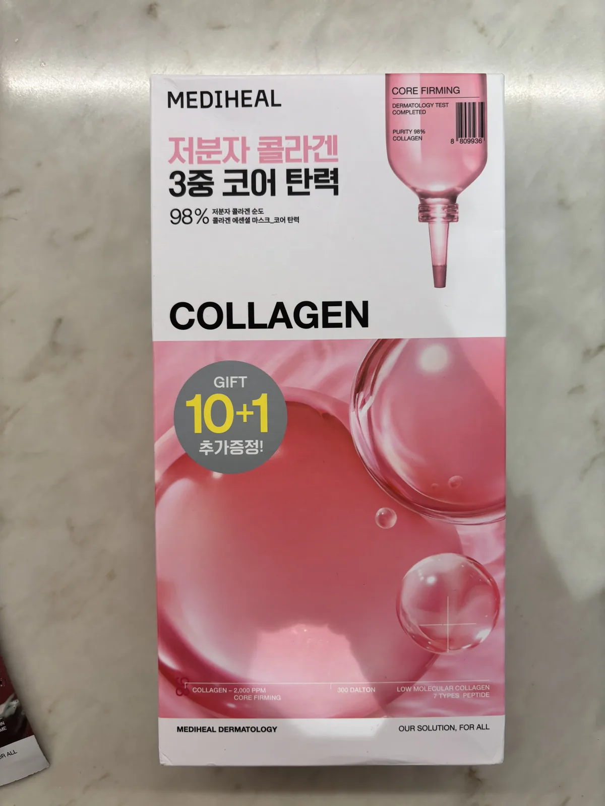 Mediheal mask Collagen Essential box in pink showing COLLAGEN 98 percent and a GIFT 10 plus 1 sticker