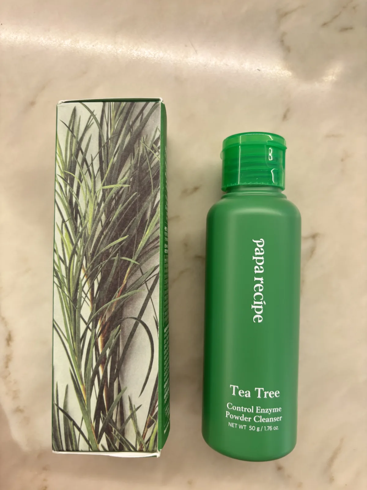 Papa Recipe Tea Tree Cleanser box side with tea-tree leaf illustration beside the green bottle