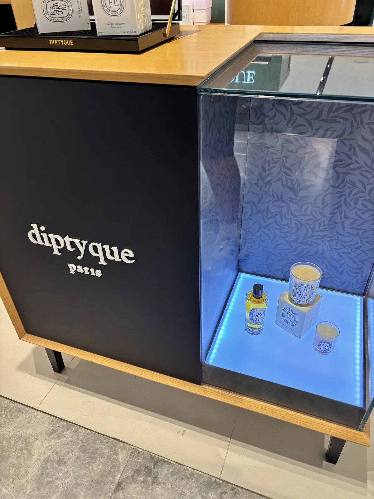 Niche fragrance counter on a Seoul department store beauty hall with a digital display