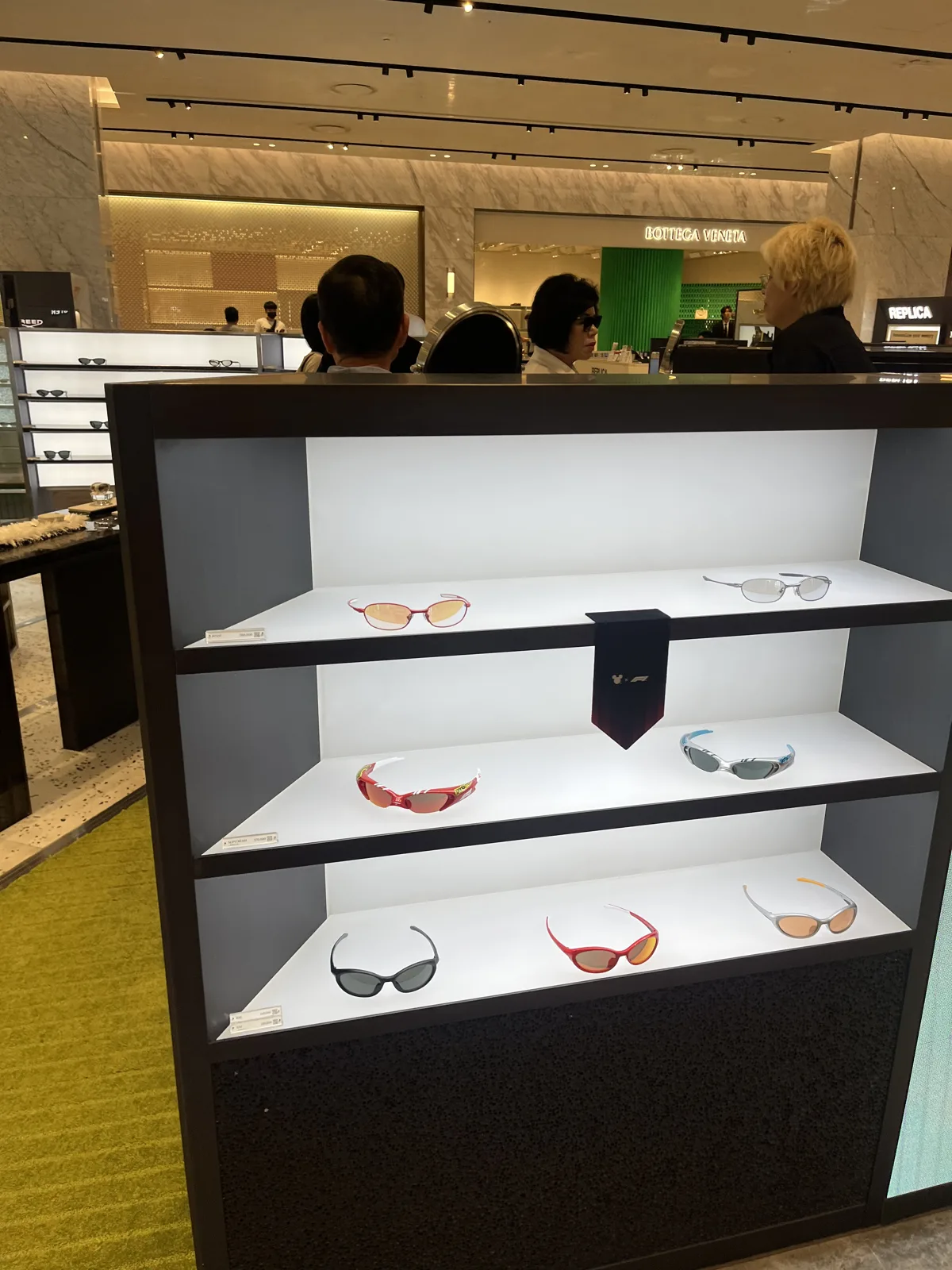 Premium beauty counter with glass display cases in a Seoul department store beauty hall