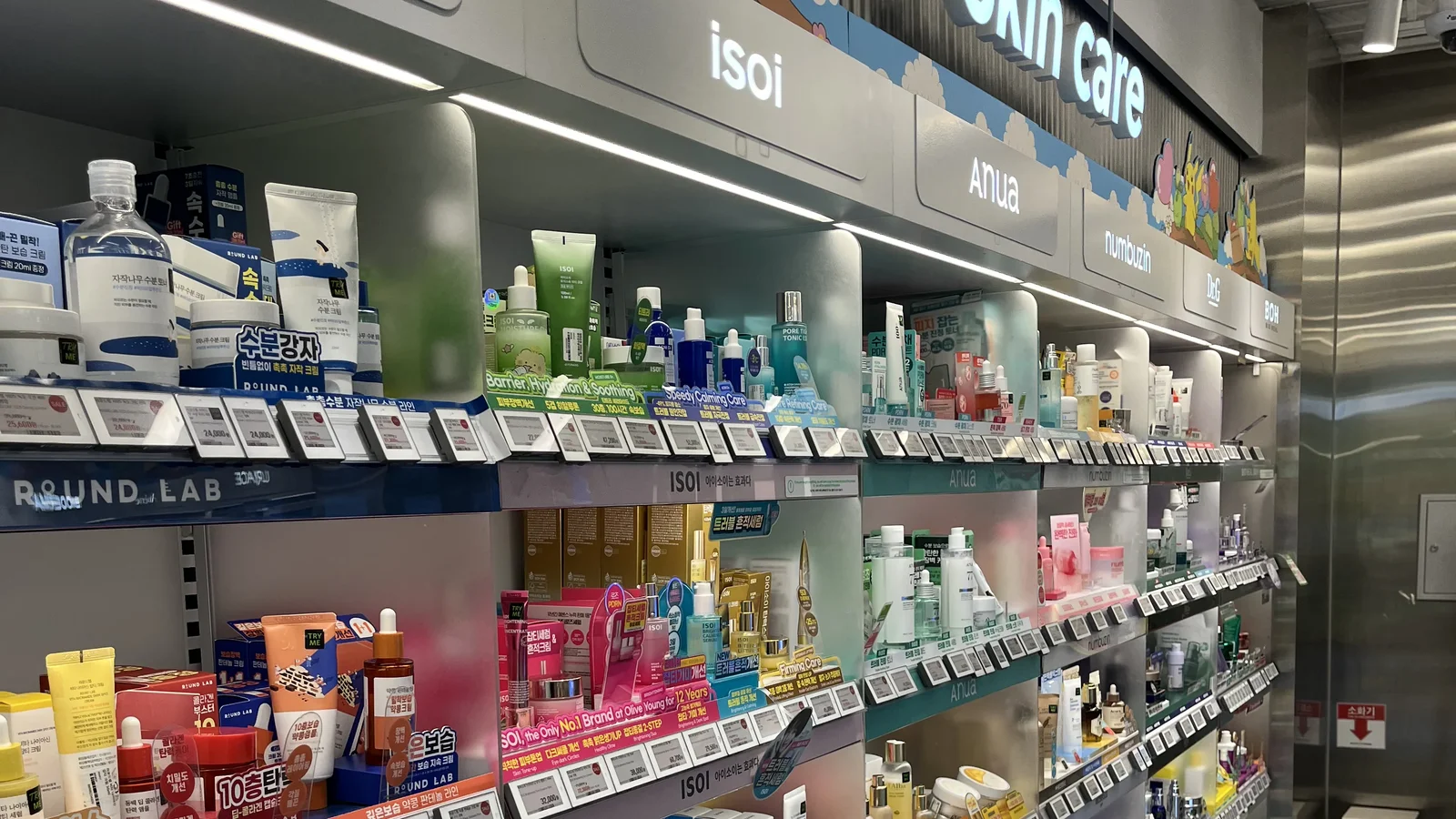 ROUND LAB, isoi, Anua and numbuzin shelves at Olive Young Gangnam — brands the free Korean skincare quiz matches to your skin type