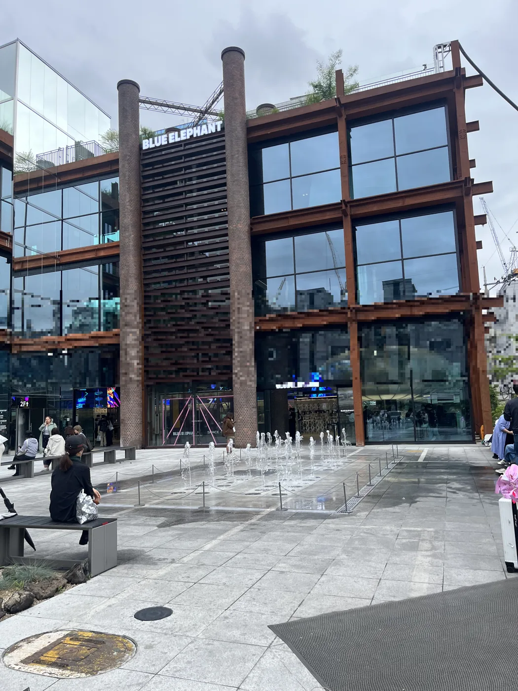 Seongsu photo spots: the BLUE ELEPHANT glass-and-steel building and fountain plaza