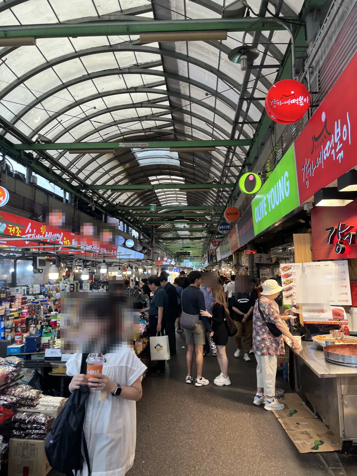 Seoul food markets: Gwangjang Market main aisle with red lanterns