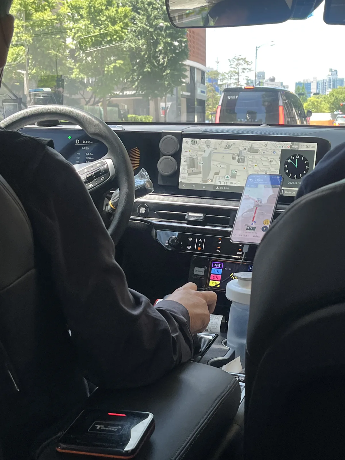 Taxis in Korea: inside a Seoul taxi with the driver's navigation screen on the dashboard